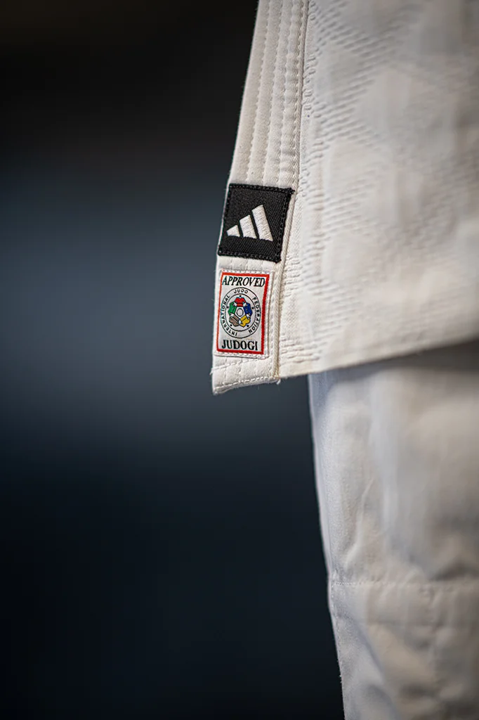 Close-up of a judo gi tag used for judo camp packing guidance