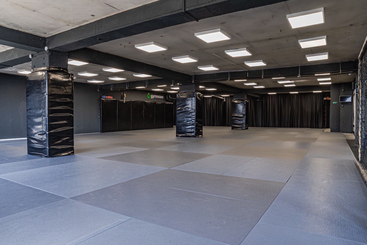 Large judo tatami training area inside the Gymnasia facility in Tbilisi