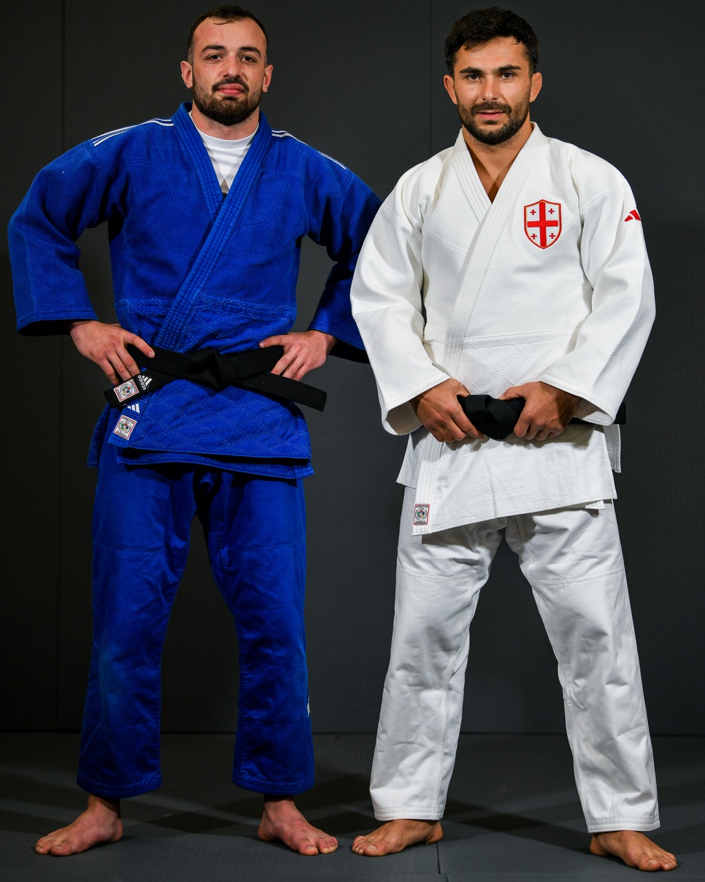 Judoka in a white gi preparing for camp training in Tbilisi